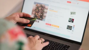 credit card and laptop with an online product page