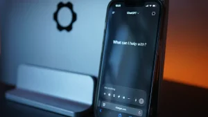 ChatGPT vs Jasper for writing — Smartphone Displaying AI Chat Interface