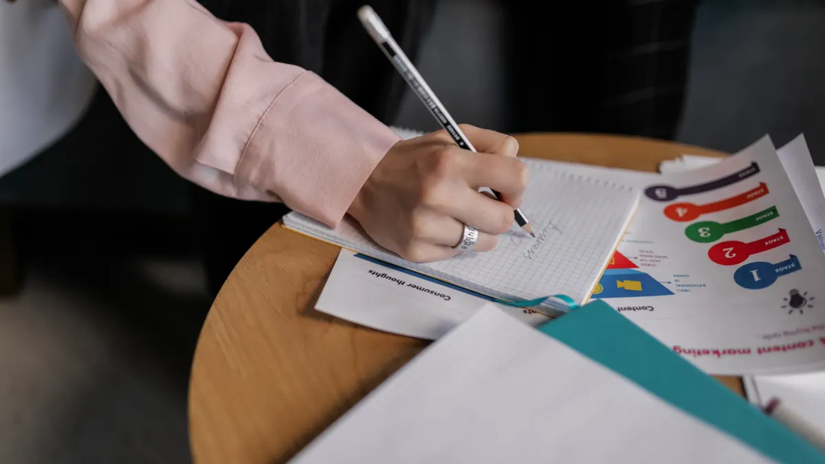 Wordtune review for rewriting and editing Wordtune review for rewriting and editing — A Person Writing on a Notebook with a Pencil